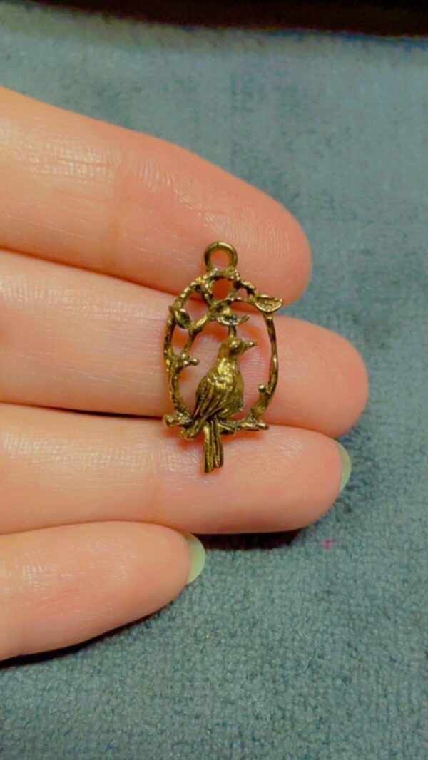 Copper bird charm